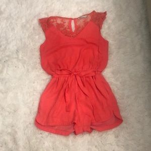 Coral romper with lace sleeve detail